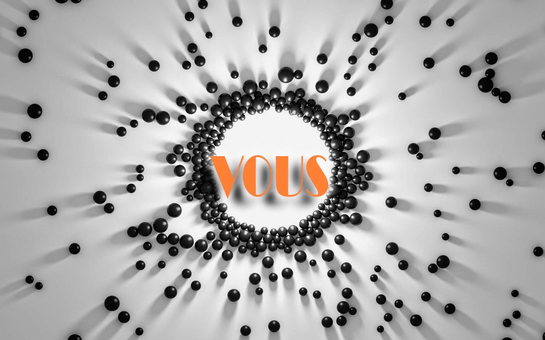 Le mot "VOUS" en orange attire des boules noires